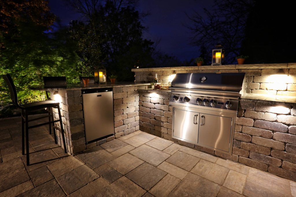 Example of a mid-sized 1960s backyard concrete paver patio kitchen design in Other