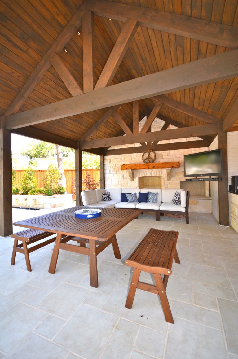 Example of a mid-sized arts and crafts backyard concrete paver patio kitchen design in Austin with a pergola