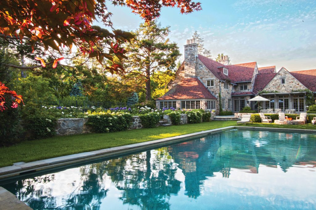 Example of a mid-sized arts and crafts backyard stone and rectangular lap pool design in New York