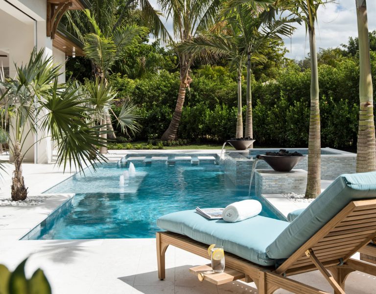 Example of a mid-sized backyard custom-shaped pool design in Other