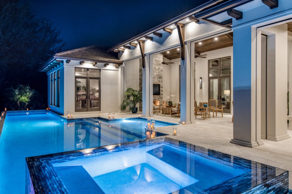 Example of a mid-sized backyard custom-shaped pool design in Other