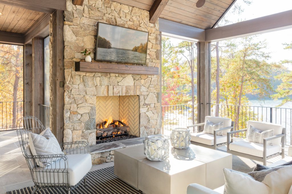 Example of a mid-sized beach style backyard deck design in Other with a fireplace and a roof extension