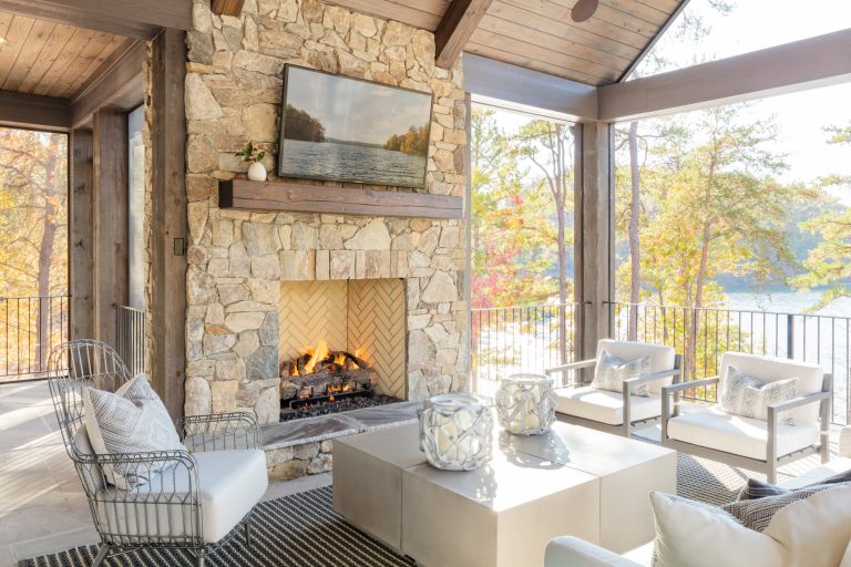 Example of a mid-sized beach style backyard deck design in Other with a fireplace and a roof extension
