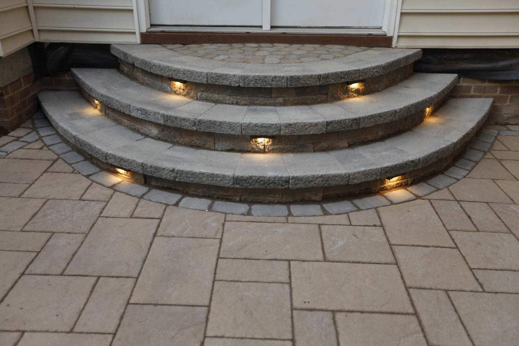 Example of a mid-sized classic backyard brick patio kitchen design in Richmond with a pergola