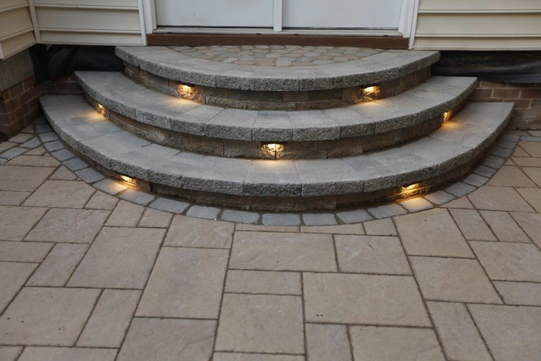 Example of a mid-sized classic backyard brick patio kitchen design in Richmond with a pergola