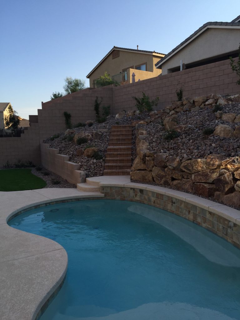 Example of a mid-sized classic backyard concrete and kidney-shaped pool design in Las Vegas