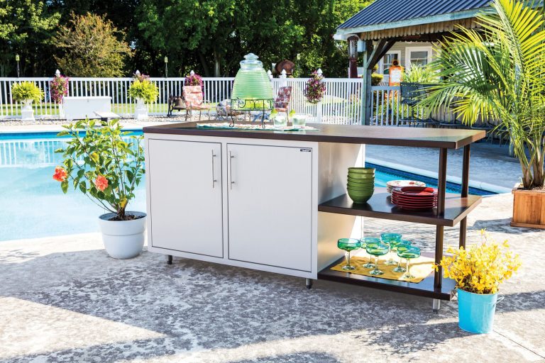 Example of a mid-sized classic backyard concrete patio kitchen design in Other with no cover