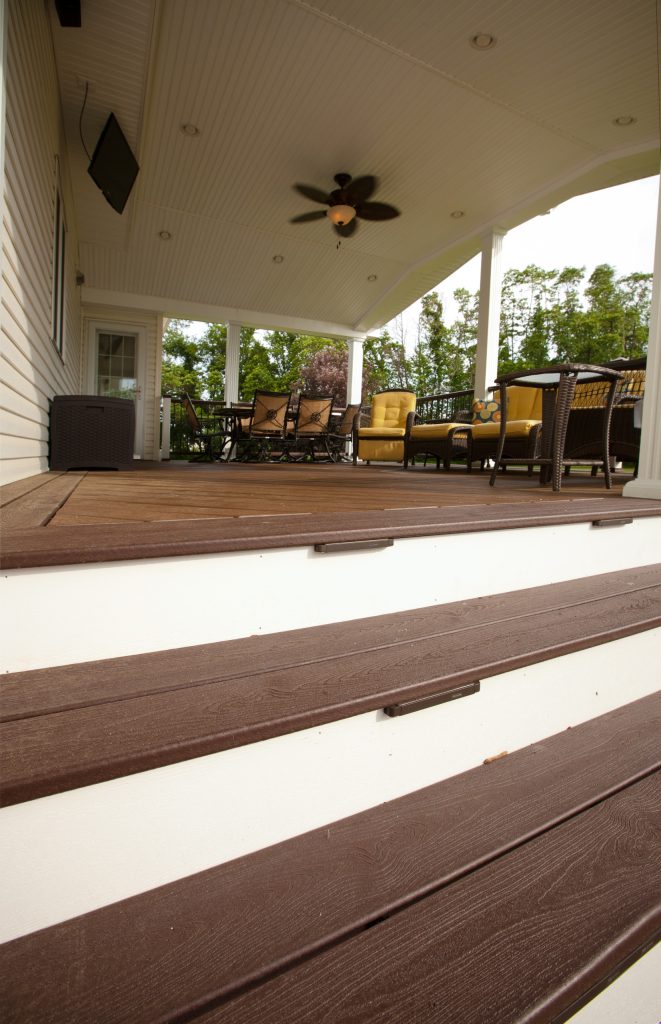 Example of a mid-sized classic backyard patio kitchen design in Philadelphia with decking and a roof extension