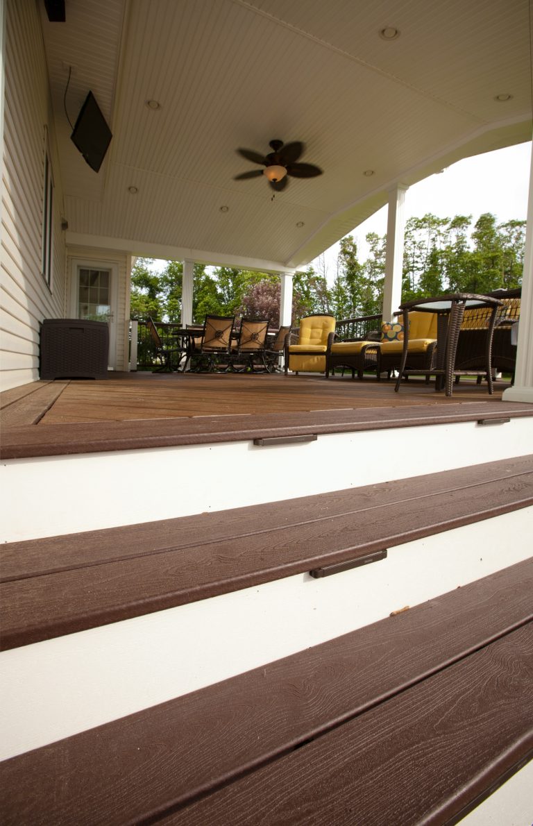 Example of a mid-sized classic backyard patio kitchen design in Philadelphia with decking and a roof extension