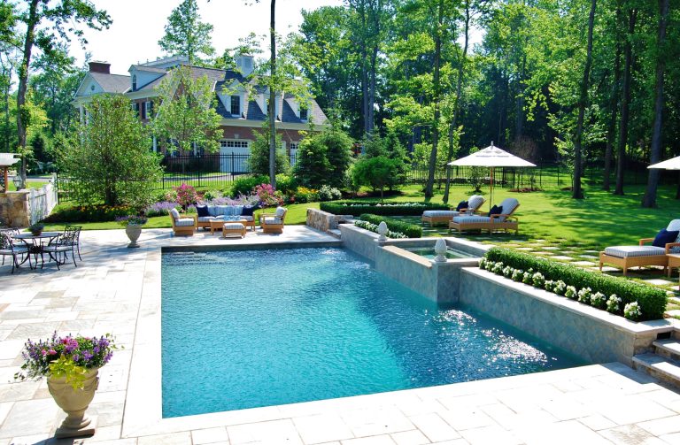Example of a mid-sized classic backyard stone and rectangular lap hot tub design in New York