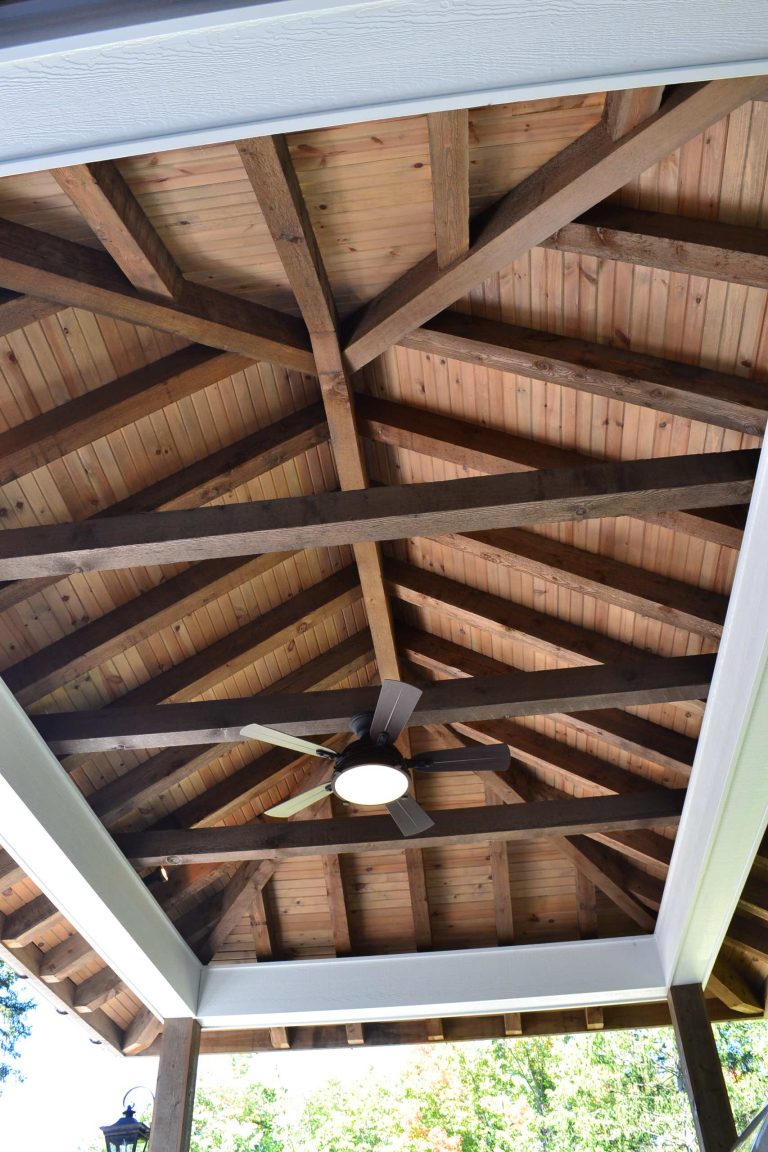 Example of a mid-sized classic backyard stone patio kitchen design in Cleveland with a gazebo