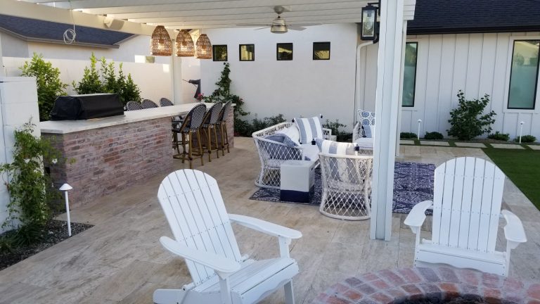 Example of a mid-sized cottage backyard tile patio kitchen design in Phoenix with a pergola