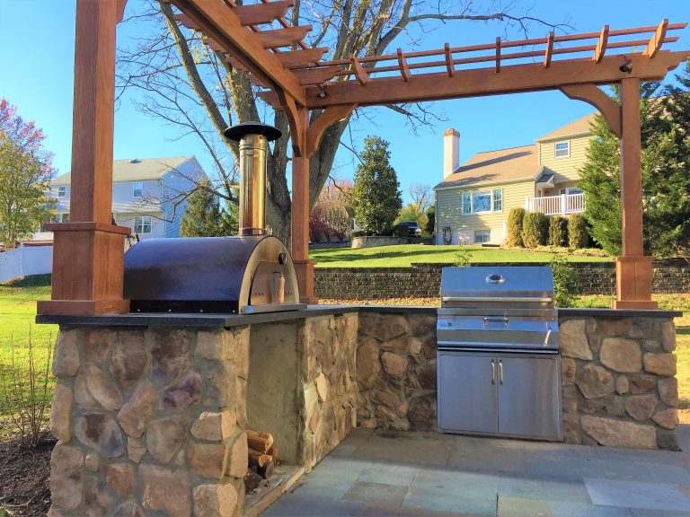 Example of a mid-sized country backyard patio kitchen design in Philadelphia