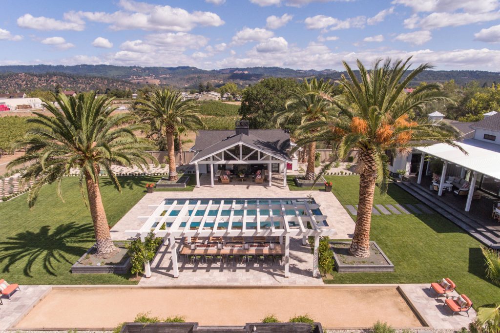 Example of a mid-sized country backyard stone and rectangular lap pool house design in San Francisco