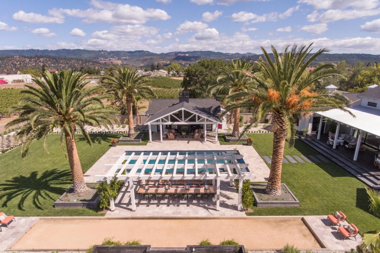 Example of a mid-sized country backyard stone and rectangular lap pool house design in San Francisco