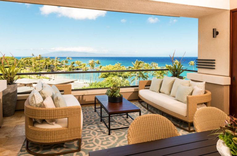 Example of a mid-sized island style rooftop rooftop outdoor kitchen deck design in Hawaii with a roof extension