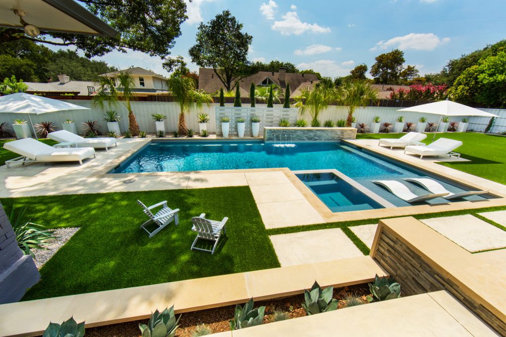 Example of a mid-sized minimalist backyard rectangular hot tub design in Dallas