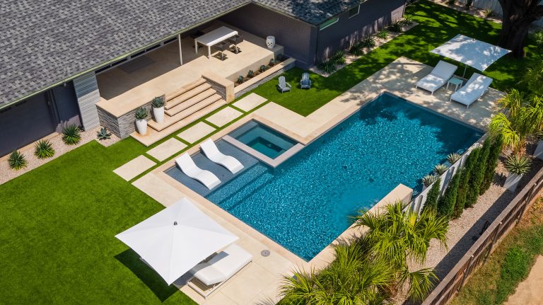 Example of a mid-sized minimalist backyard rectangular hot tub design in Dallas