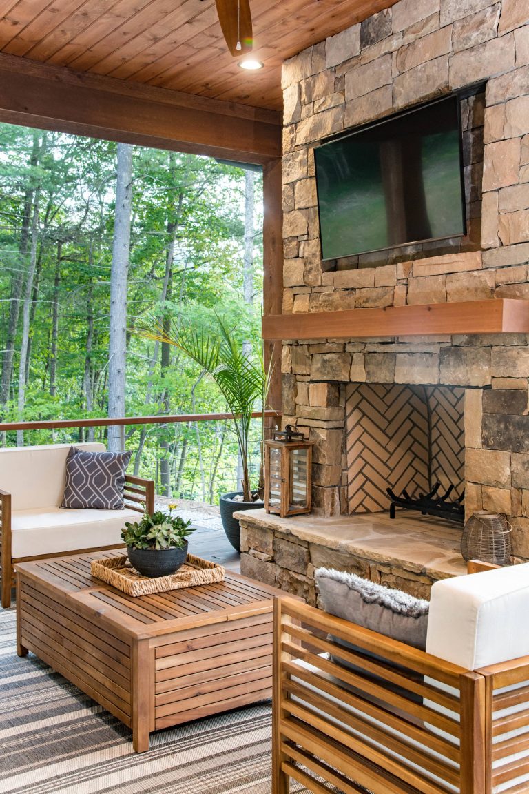 Example of a mid-sized mountain style backyard patio kitchen design in Other with decking and a roof extension