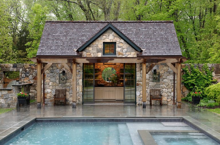 Example of a mid-sized mountain style rectangular pool house design in New York