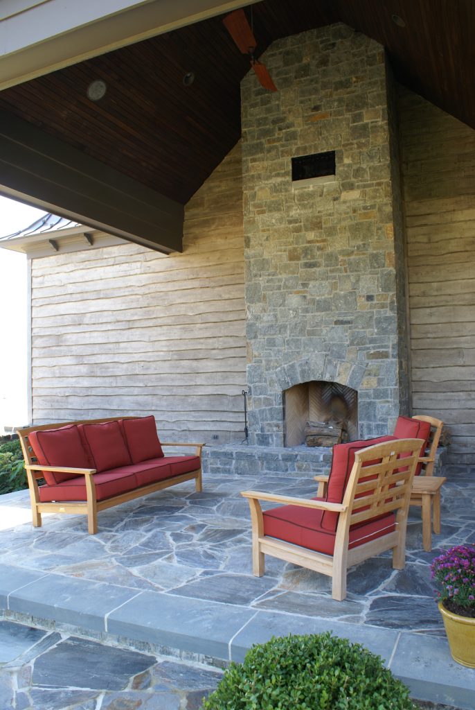 Example of a mid-sized side yard stone patio design in DC Metro with a roof extension by C.E.I. | Outdoor Photos | Porch | Landscaping | Landscape Design | Outdoor Living Space | Porch Design Ideas | Outdoor Living Space Ideas | Backyard Design