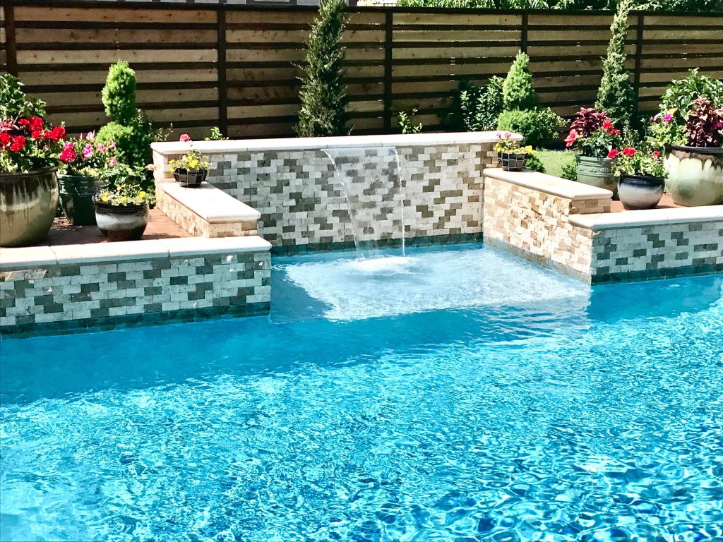 Example of a mid-sized transitional backyard rectangular lap hot tub design in Kansas City