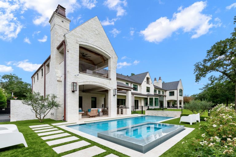 Example of a mid-sized transitional backyard stone and rectangular hot tub design in Houston
