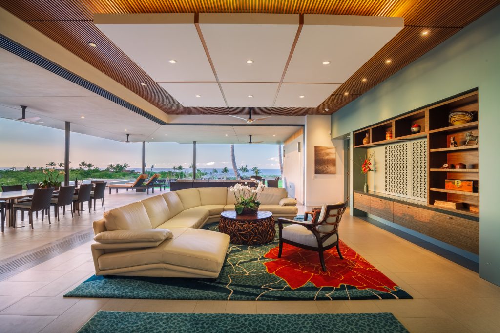 Example of a mid-sized trendy backyard concrete patio kitchen design in Hawaii with a roof extension