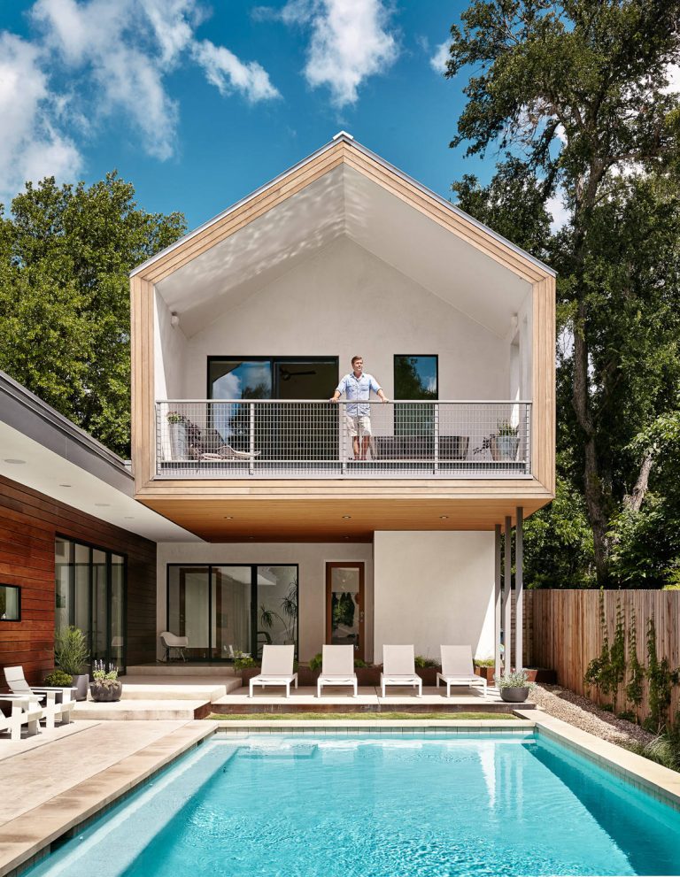 Example of a mid-sized trendy backyard concrete paver and rectangular lap pool design in Austin