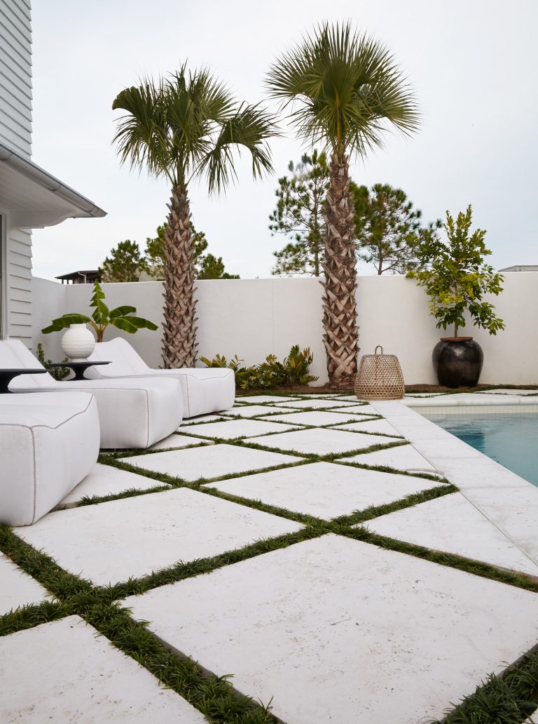 Example of a mid-sized trendy backyard concrete paver and rectangular lap pool design in Miami