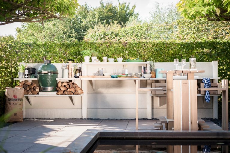 Example of a mid-sized trendy backyard concrete paver patio kitchen design in Los Angeles with no cover