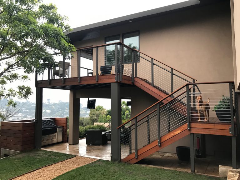 Example of a mid-sized trendy backyard deck design in San Francisco with a roof extension