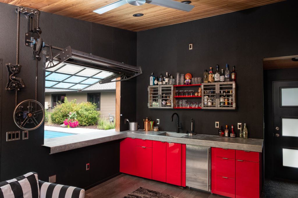 Example of a mid-sized trendy backyard patio kitchen design in Other