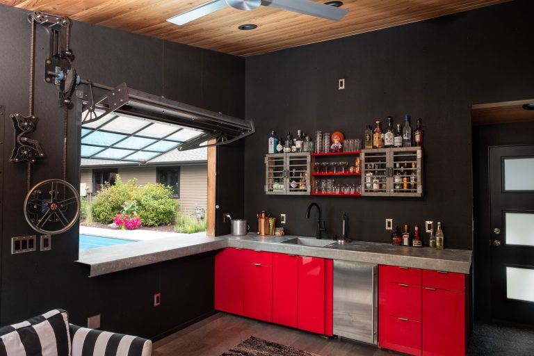 Example of a mid-sized trendy backyard patio kitchen design in Other