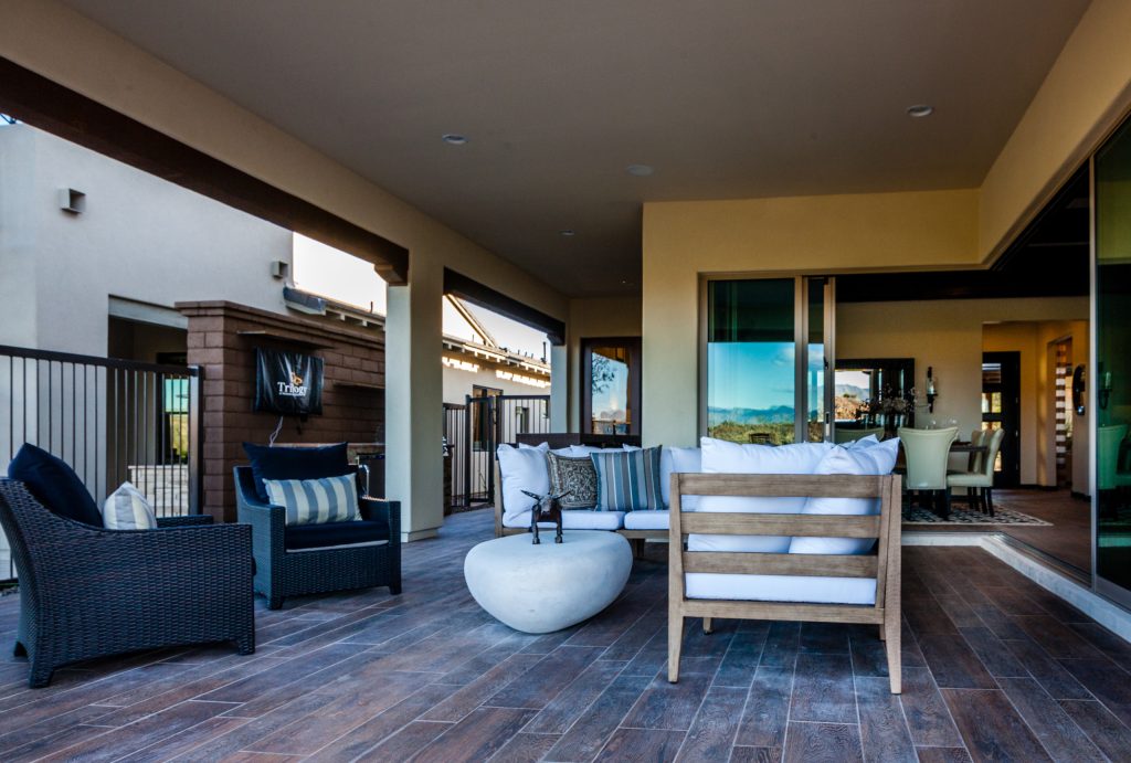 Example of a mid-sized trendy backyard patio kitchen design in Phoenix with decking and a roof extension