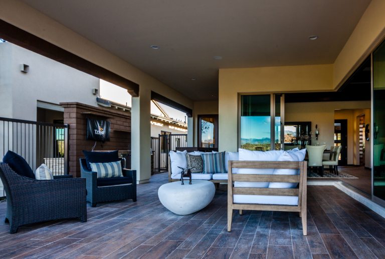 Example of a mid-sized trendy backyard patio kitchen design in Phoenix with decking and a roof extension