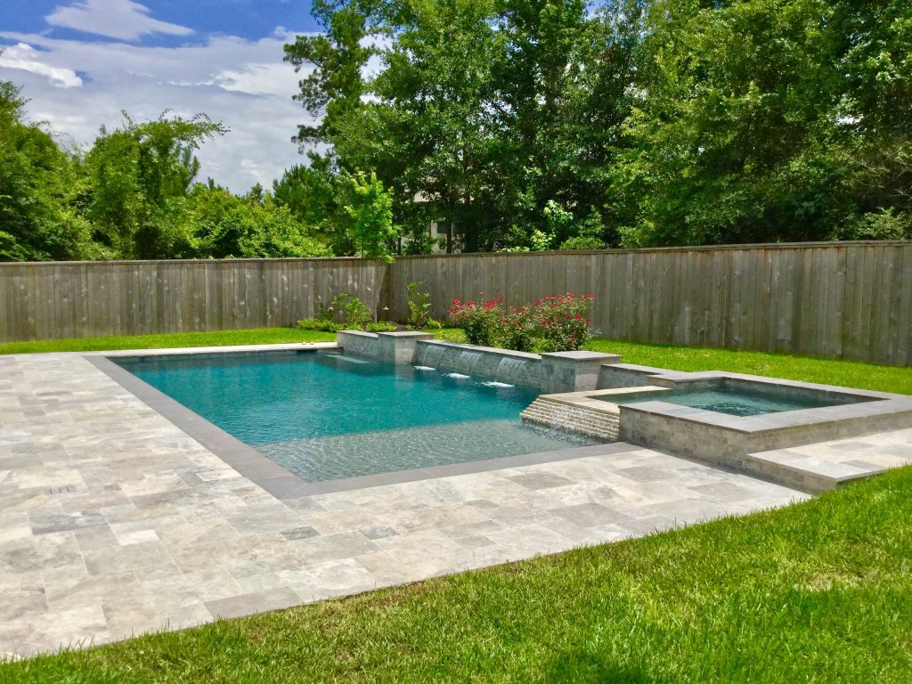 Example of a mid-sized trendy backyard stone and rectangular lap hot tub design in Houston