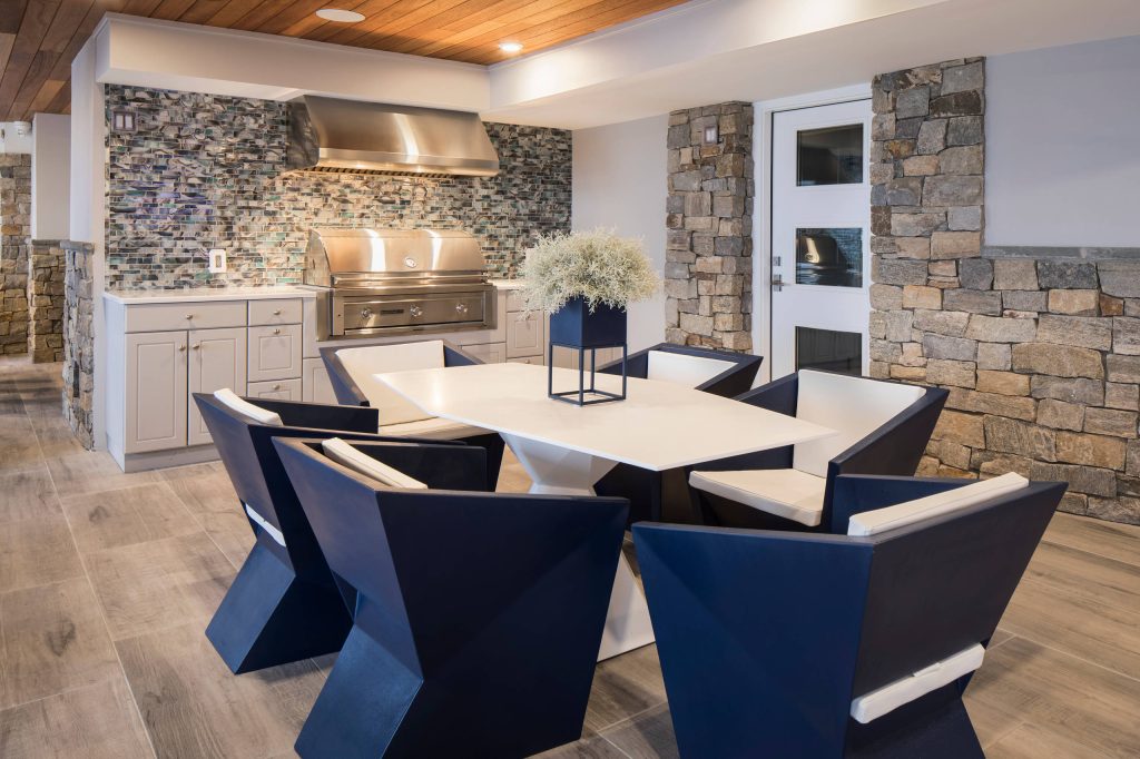 Example of a mid-sized trendy backyard tile patio kitchen design in Philadelphia with a roof extension