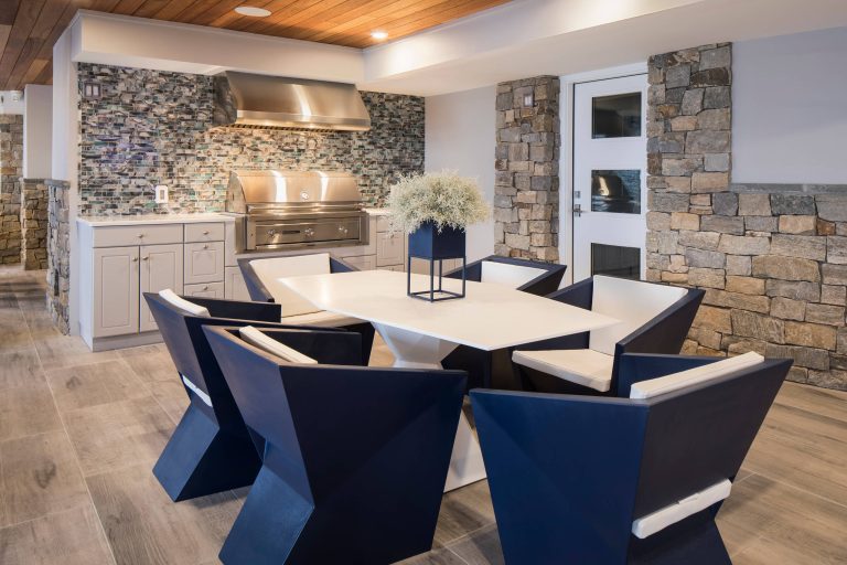 Example of a mid-sized trendy backyard tile patio kitchen design in Philadelphia with a roof extension
