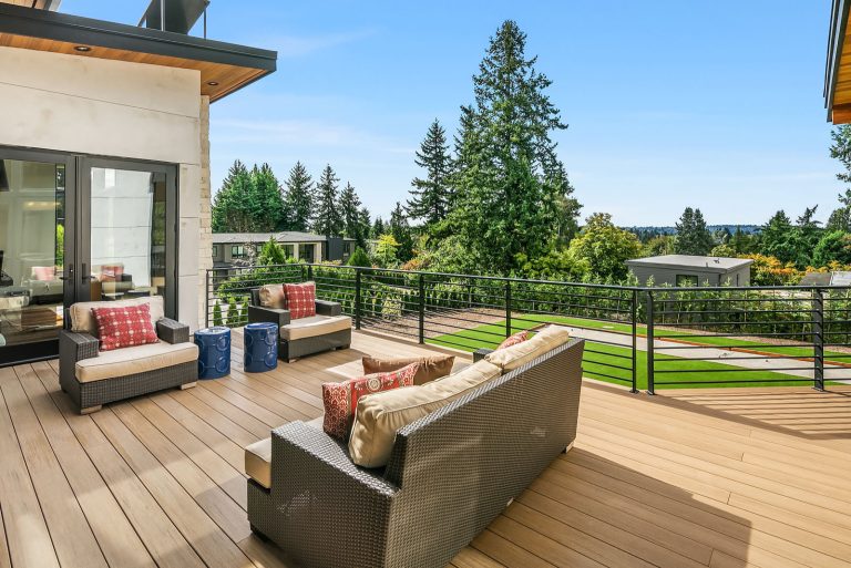 Example of a mid-sized trendy deck design in Denver with no cover