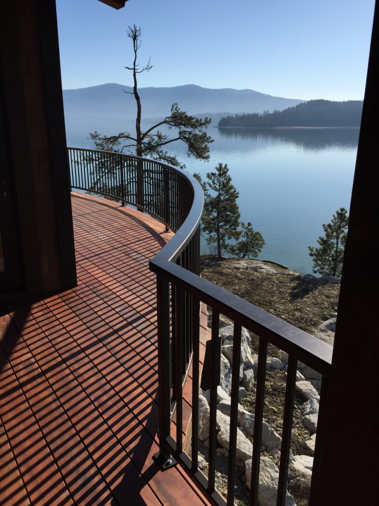 Example of a mid-sized trendy side yard deck design in San Diego with no cover