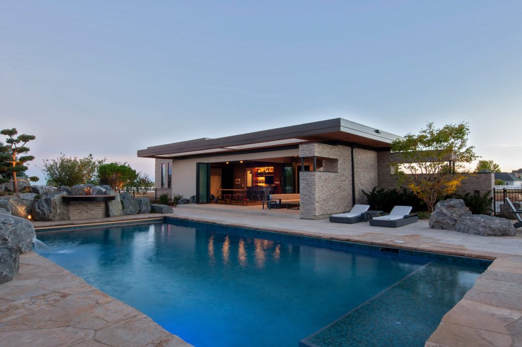 Example of a minimalist pool house design in Denver