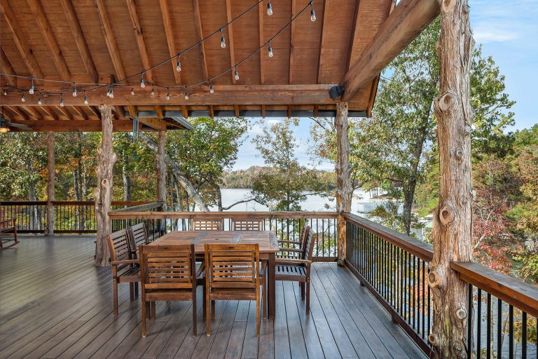 Example of a mountain style deck design in Other with a roof extension