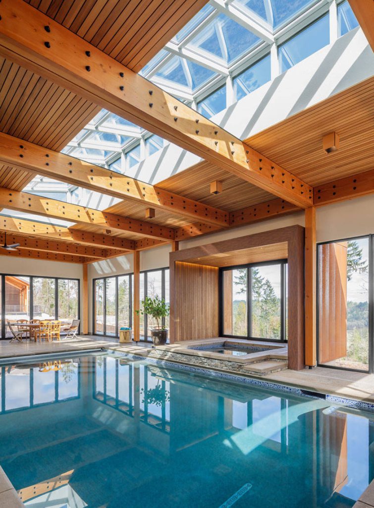 Example of a mountain style indoor rectangular pool design in Other