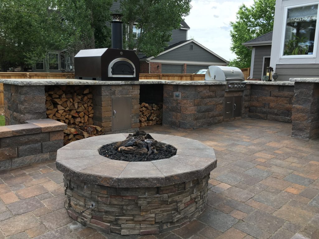 Example of a small classic backyard concrete paver patio kitchen design in Denver