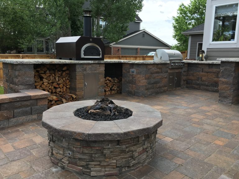 Example of a small classic backyard concrete paver patio kitchen design in Denver