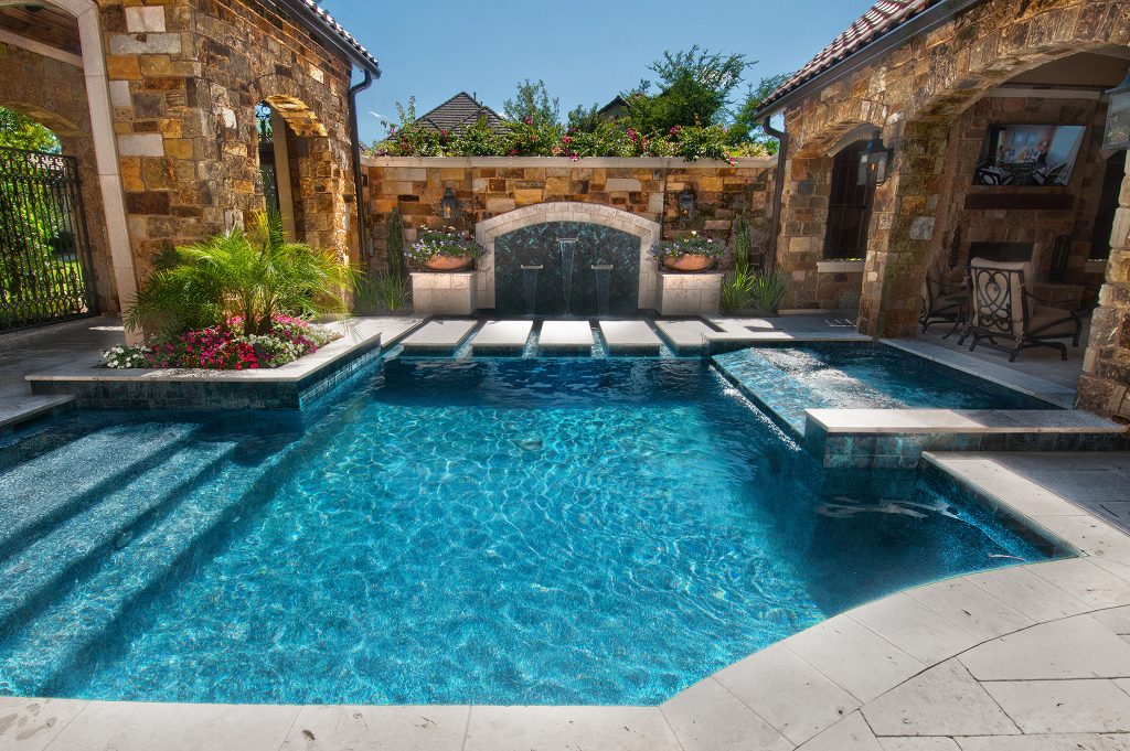 Example of a small classic courtyard rectangular and tile pool fountain design in Houston
