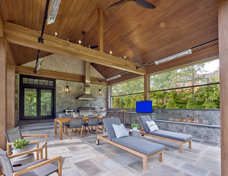 Example of a transitional backyard patio kitchen design in Other with a roof extension