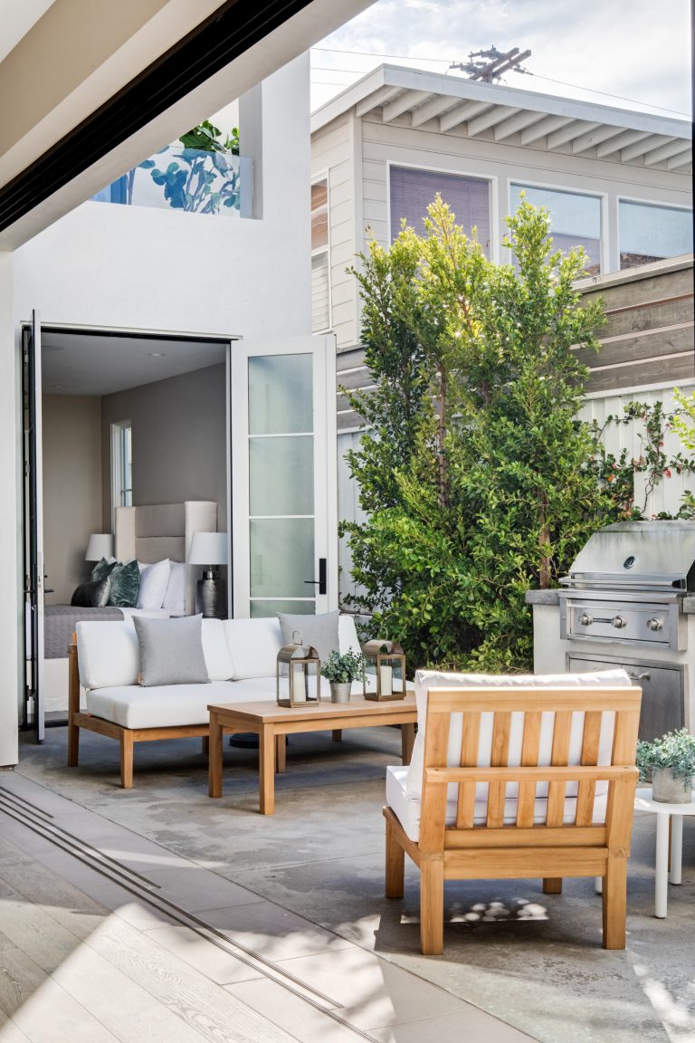 Example of a transitional courtyard concrete patio kitchen design in Orange County with no cover