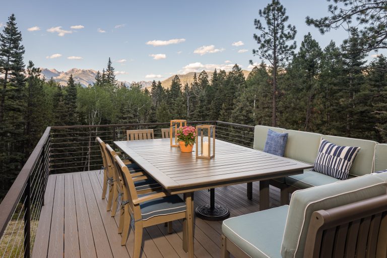 Example of a transitional second story cable railing deck design in Denver with no cover